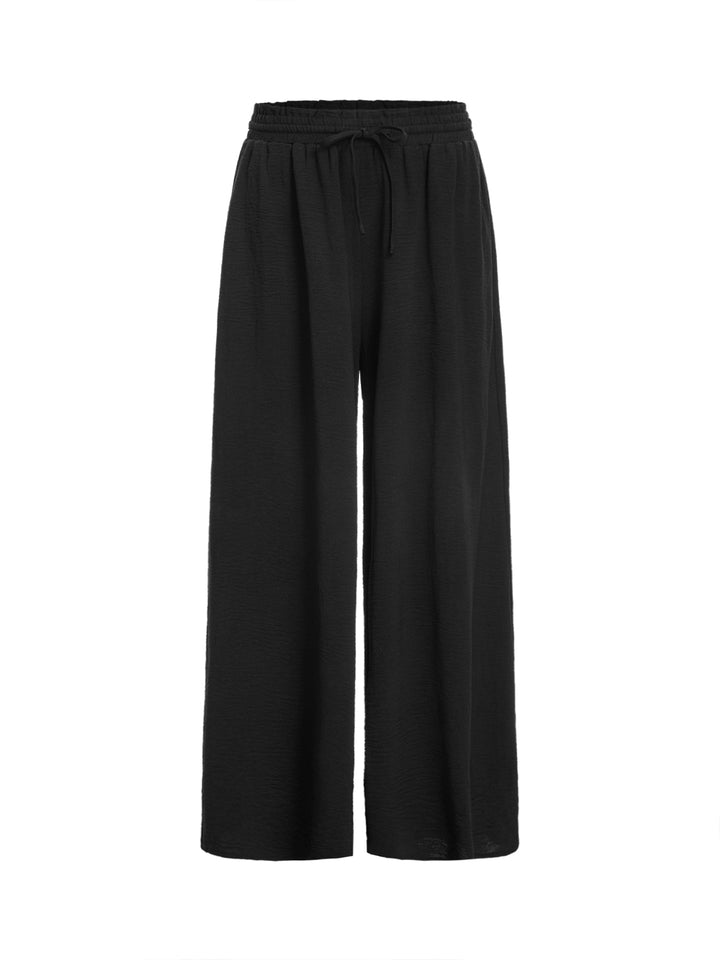 Pantalones casuales atados a los pantalones de mujeres largos