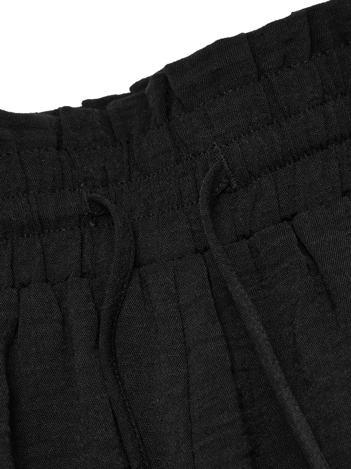 Pantalones casuales atados a los pantalones de mujeres largos