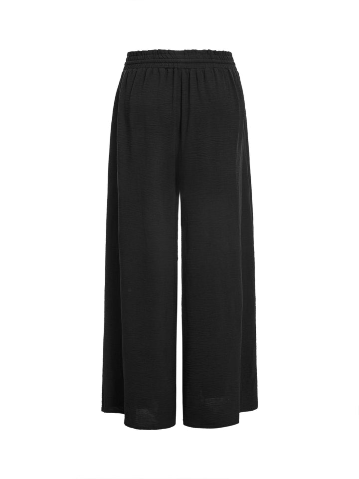 Pantalones casuales atados a los pantalones de mujeres largos
