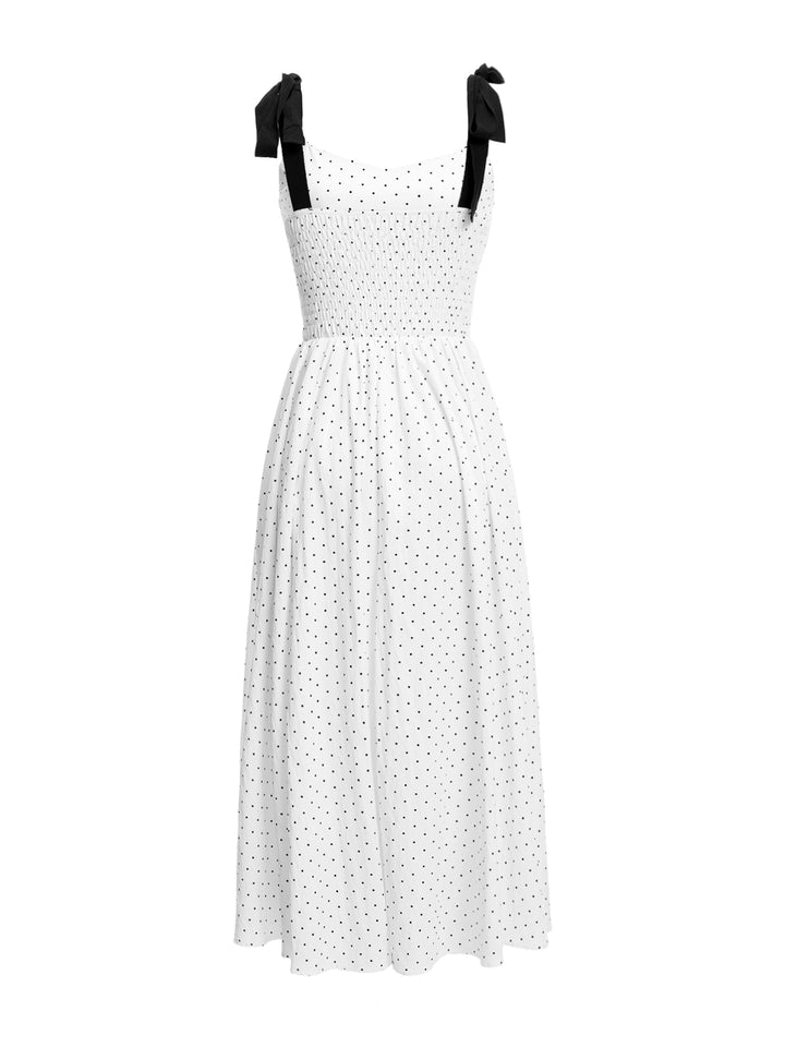 Eine Linie eleganter Polka Dot hat sich von der Schulter langen Frauen gekleidet